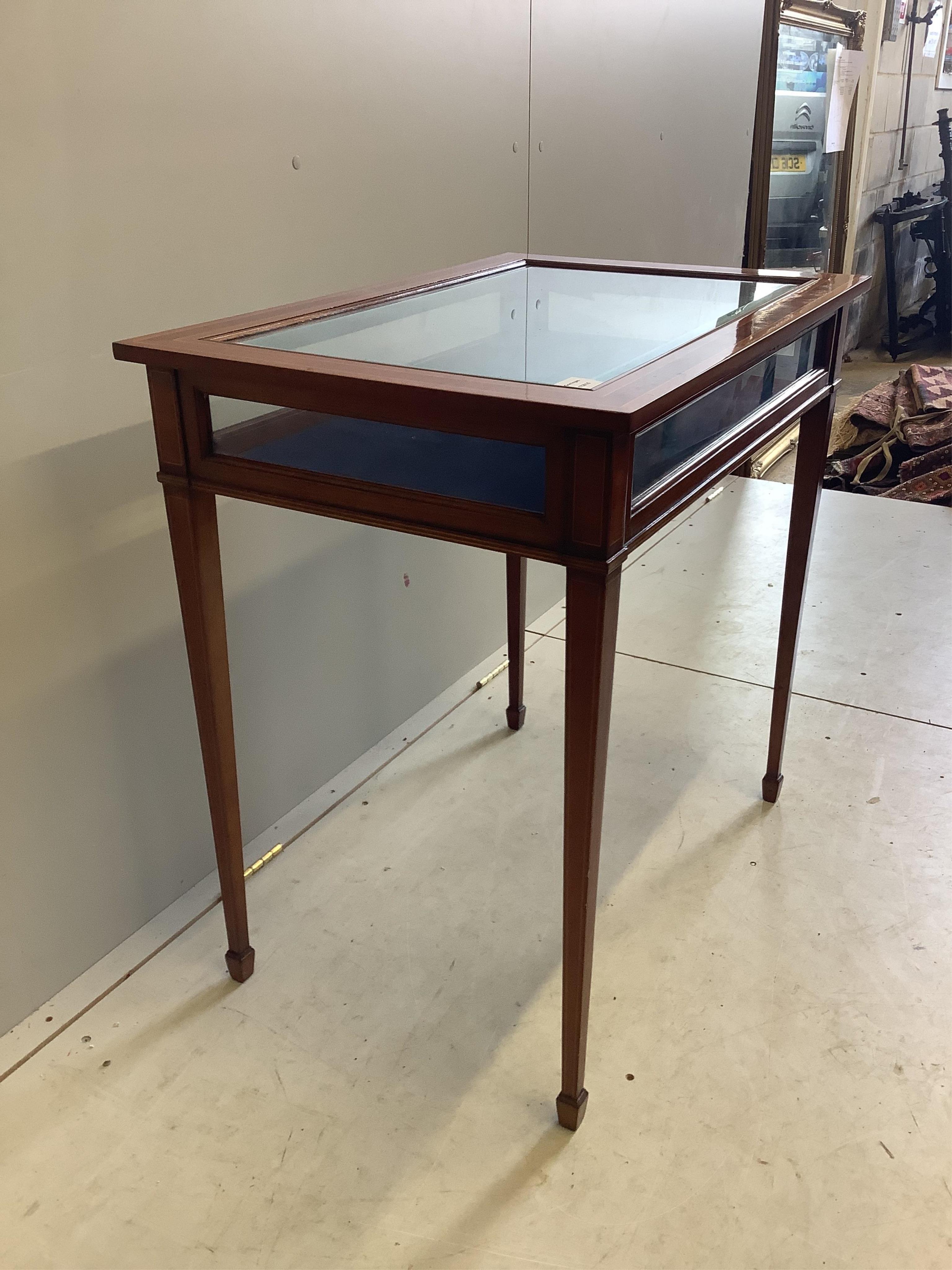 A reproduction inlaid mahogany bijouterie table, width 77cm, depth 52cm, height 76cm. Condition - good